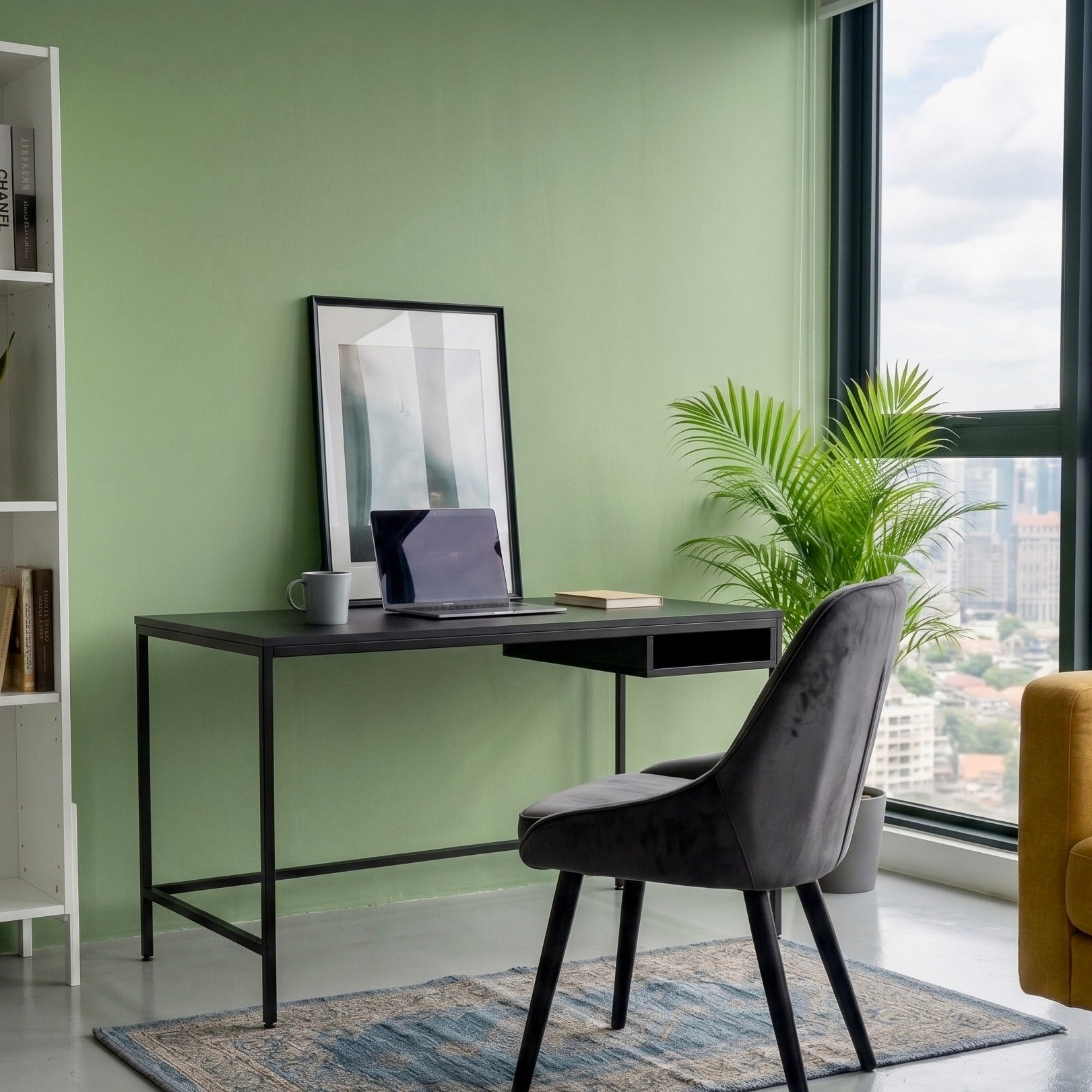 Modern home office with a desk, chair, and bookshelf against a green wall with a cityscape view.