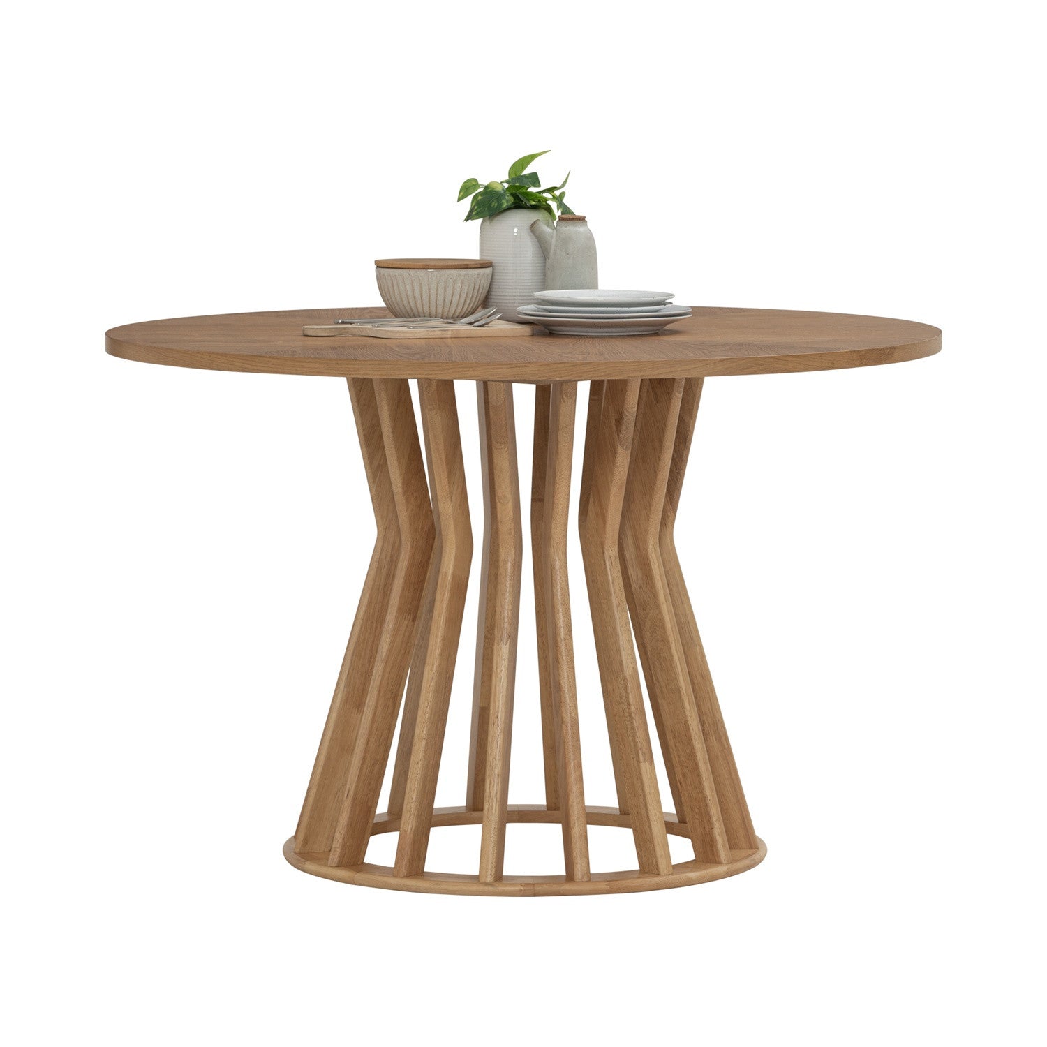 Wooden dining table with a unique base design on a white background