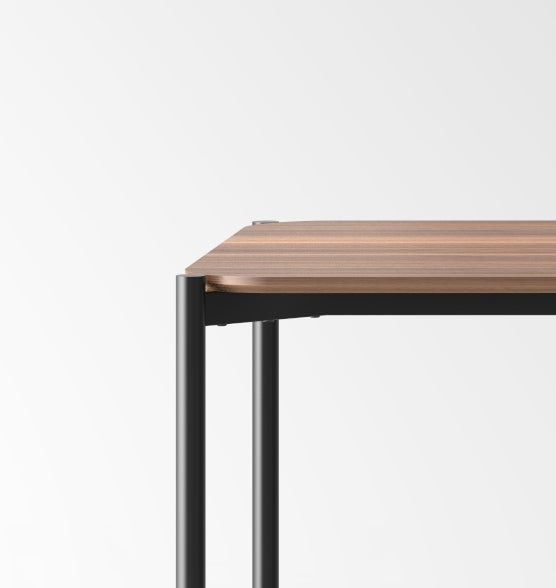 Wooden table with black metal legs on a white background
