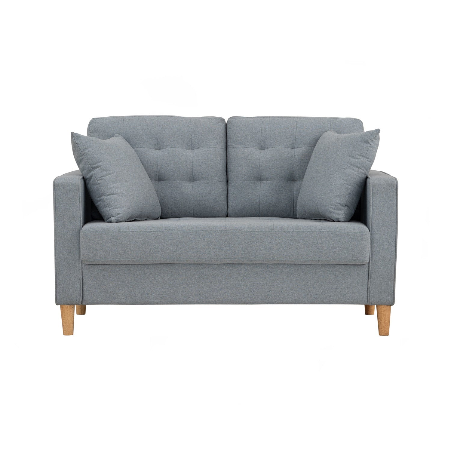 A light gray upholstered loveseat with tufted back cushions, two matching throw pillows, and light wood legs, shown against a plain white background.