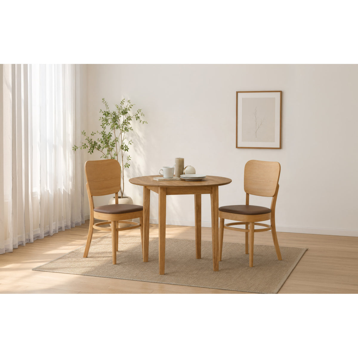 A 3-piece dining set featuring a round wooden table and two matching chairs with brown cushioned seats, styled on a beige rug in a bright, modern room.