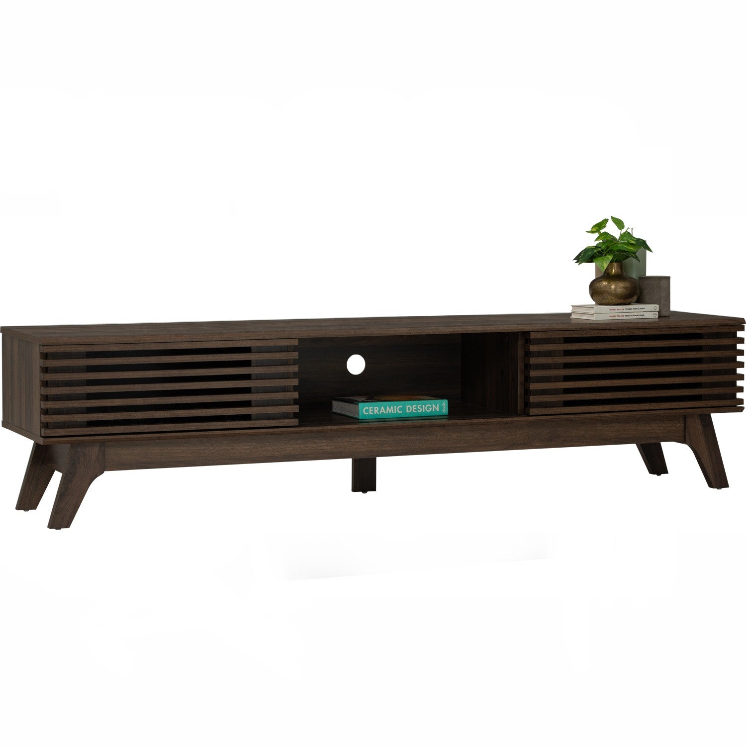 A dark brown wooden TV stand with a mid-century modern design, featuring slatted side panels, a central open shelf, and angled legs. Decorative books and a small potted plant sit on top against a plain white background.