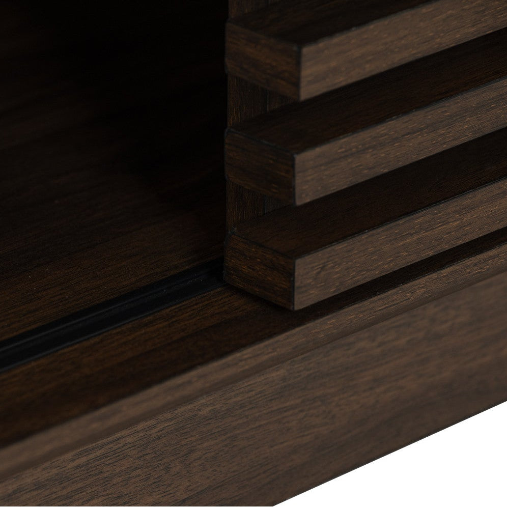 Close-up detail of a dark brown wooden furniture piece showing layered slats and a drawer or shelf edge on a white background.