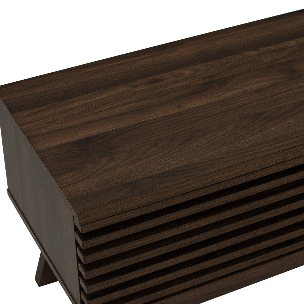 Dark brown wood media console with a slatted front design and open shelving, shown at an angle on a white background.