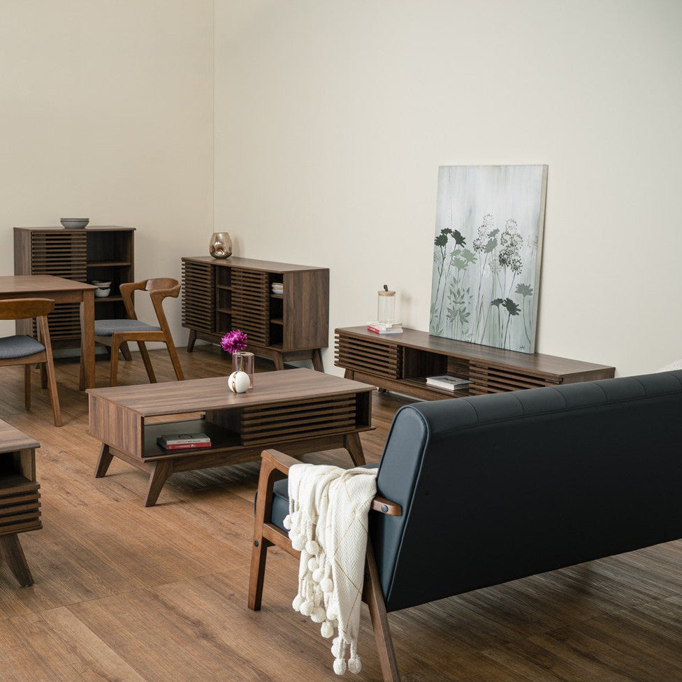Modern living room with wooden furniture and a black sofa.