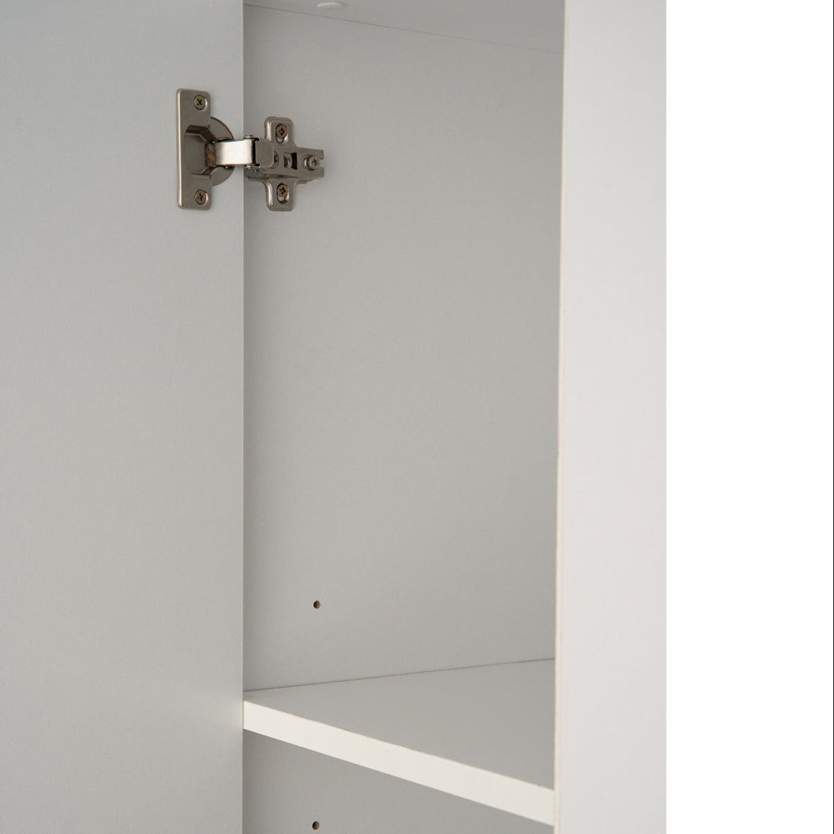 Metal cabinet hinge on a gray door
