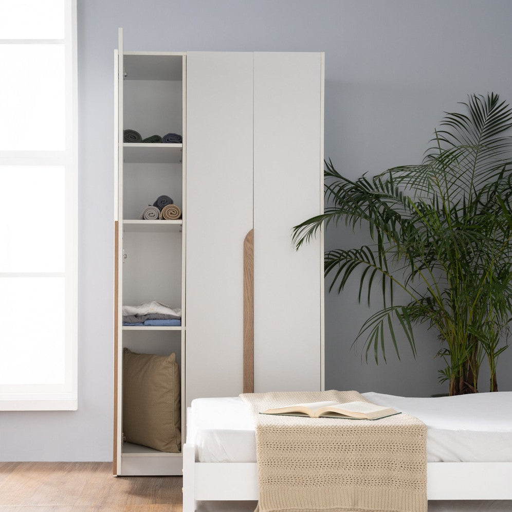 Modern bedroom with a bed and wardrobe in a minimalistic setting