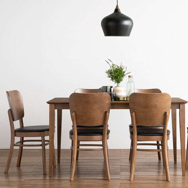 A dining room scene showing a wooden dining table with six matching chairs, a black pendant light overhead, and a small tabletop centerpiece. Below the scene, text reads 'BEVERLY Dining Chair' with a small descriptive line of copy.