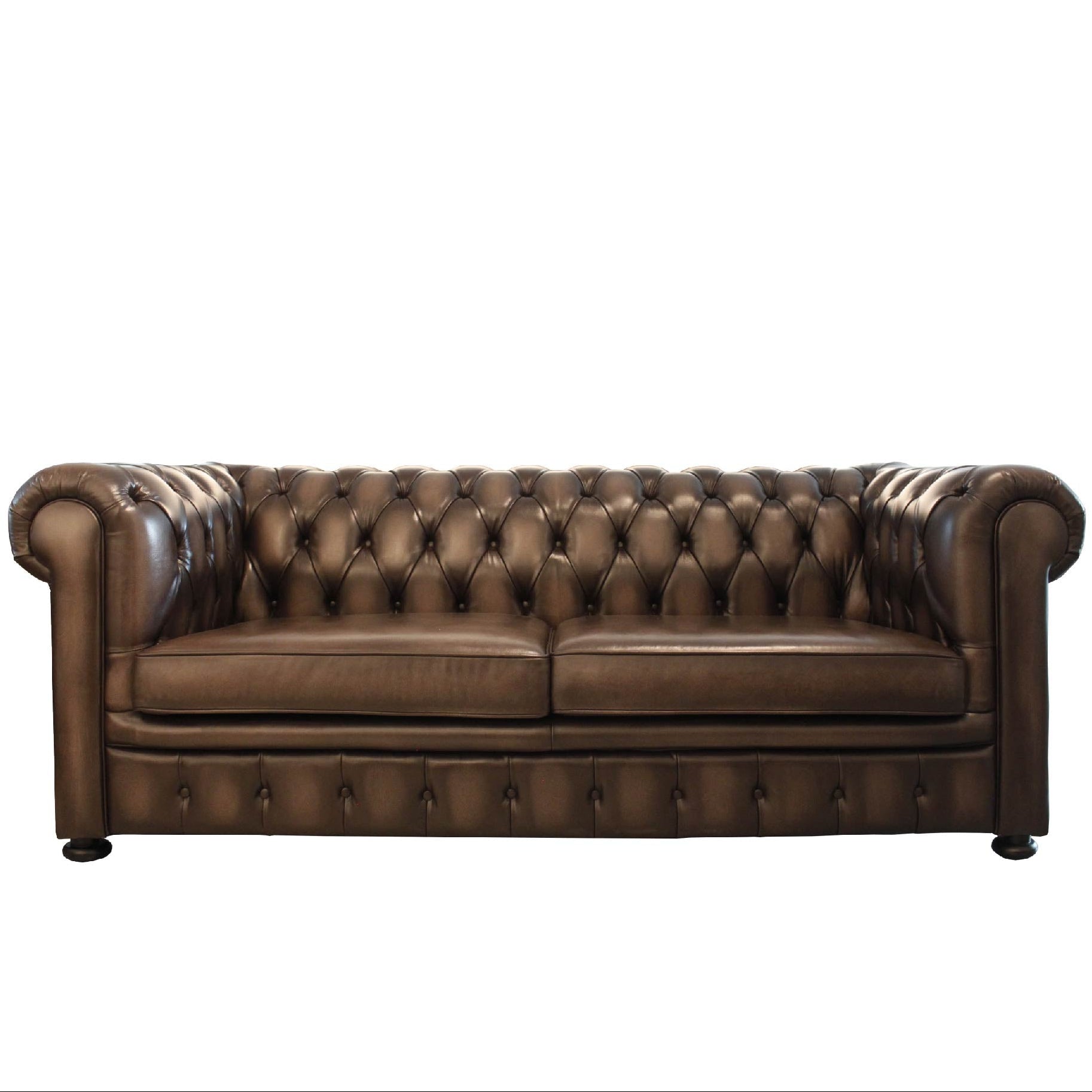 A traditional brown leather Chesterfield sofa with tufted backrest and rolled arms, featuring a hand-antique wash off finish.