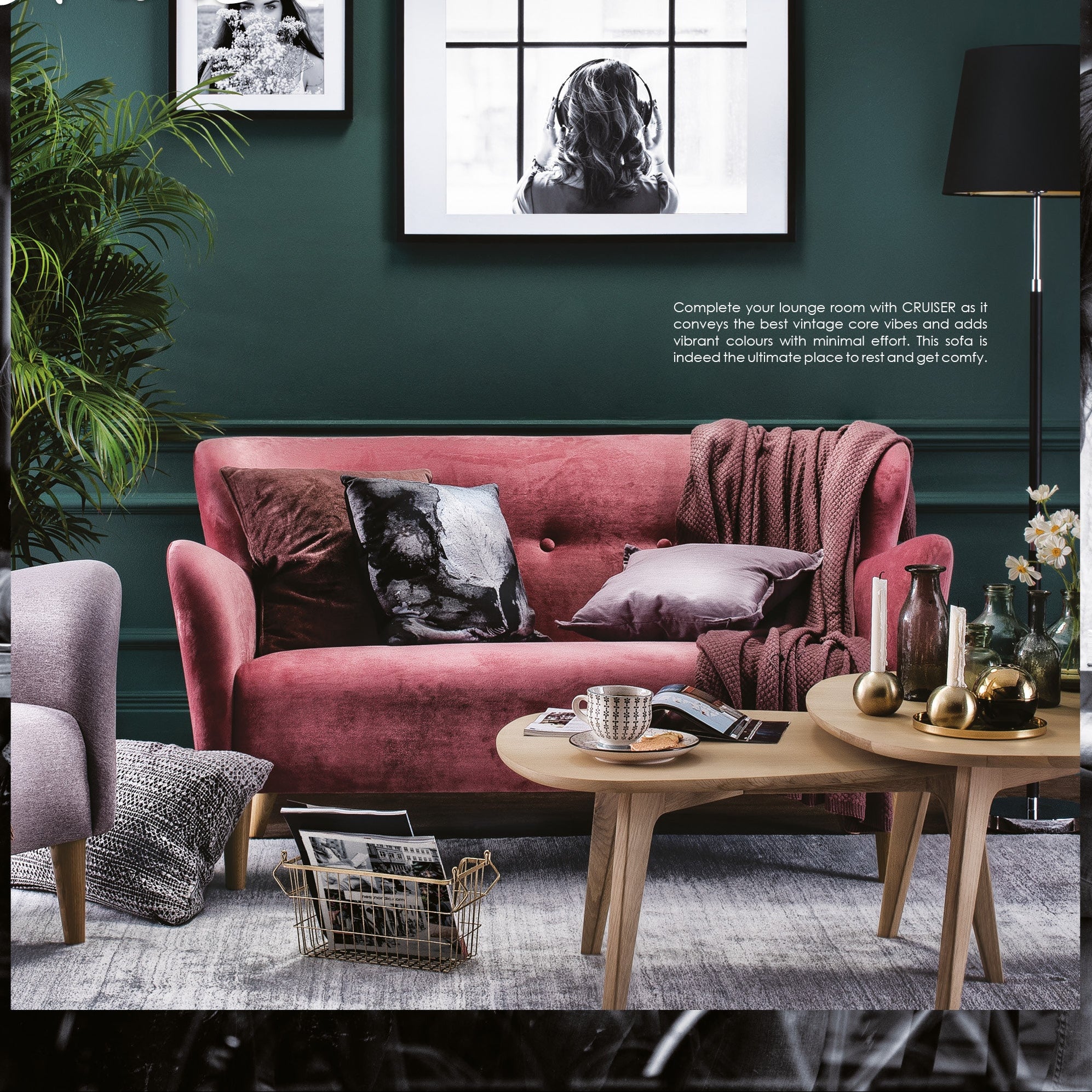 Living room with a pink sofa, wooden coffee table, and decorative elements.