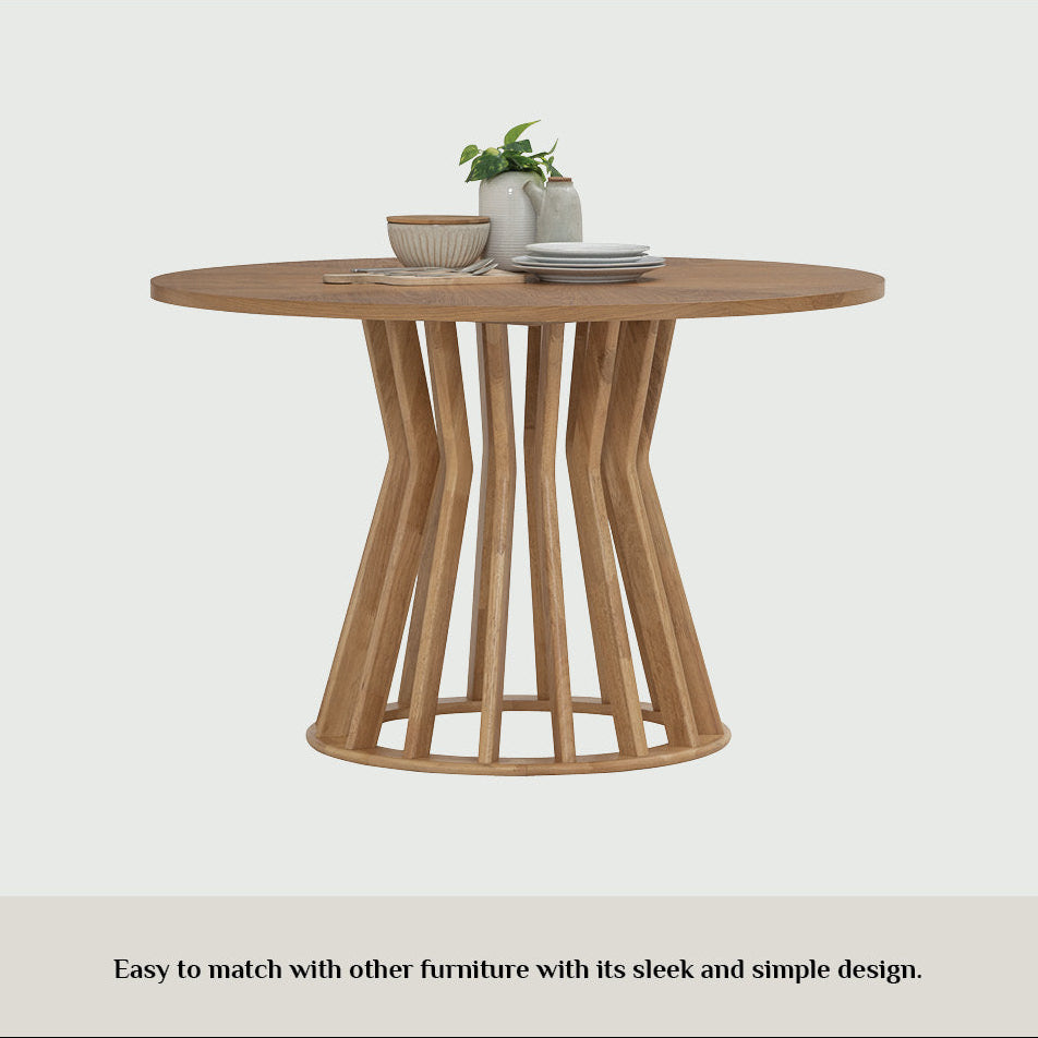 Wooden dining table with a minimalist design on a white background.