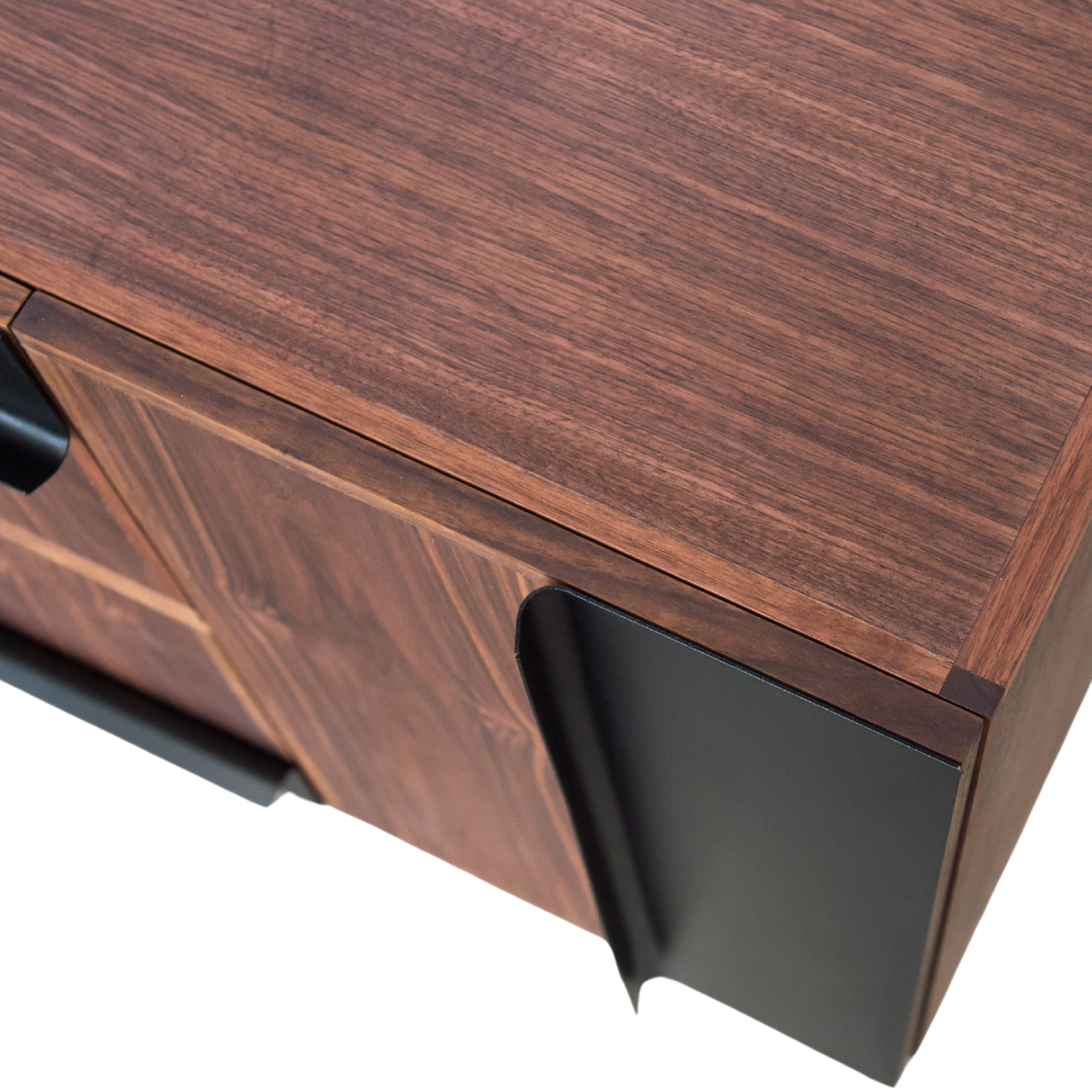 Wooden furniture corner with a black trim on a white background
