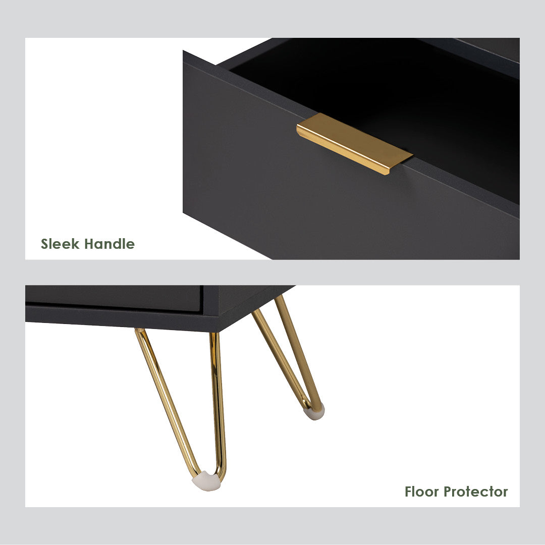 Black drawer with gold handle and legs on a light gray background