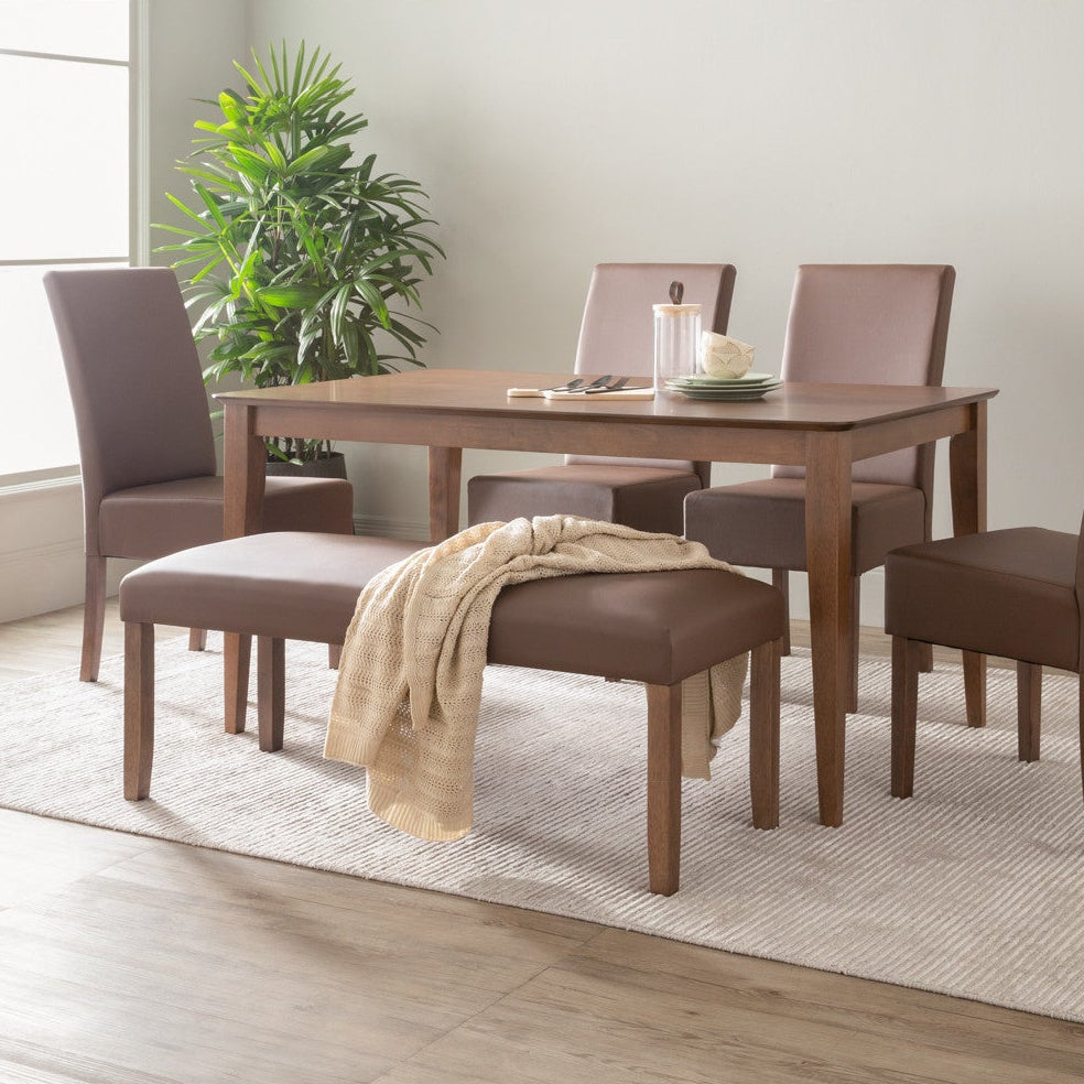 Dining room set with wooden table and chairs in a well-lit room.