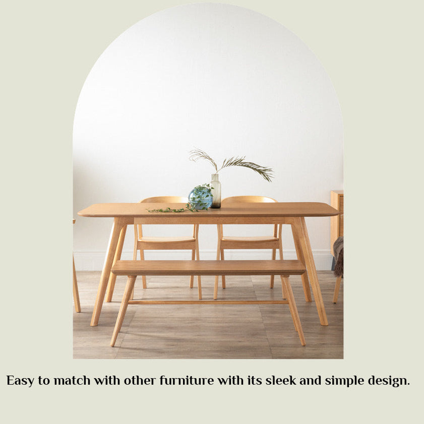 A minimalist promotional graphic for the RODEN dining table, featuring a light natural wood table and matching chairs inside a white arched frame on a beige background with the text 'RODEN' at the top and a descriptive tagline at the bottom.