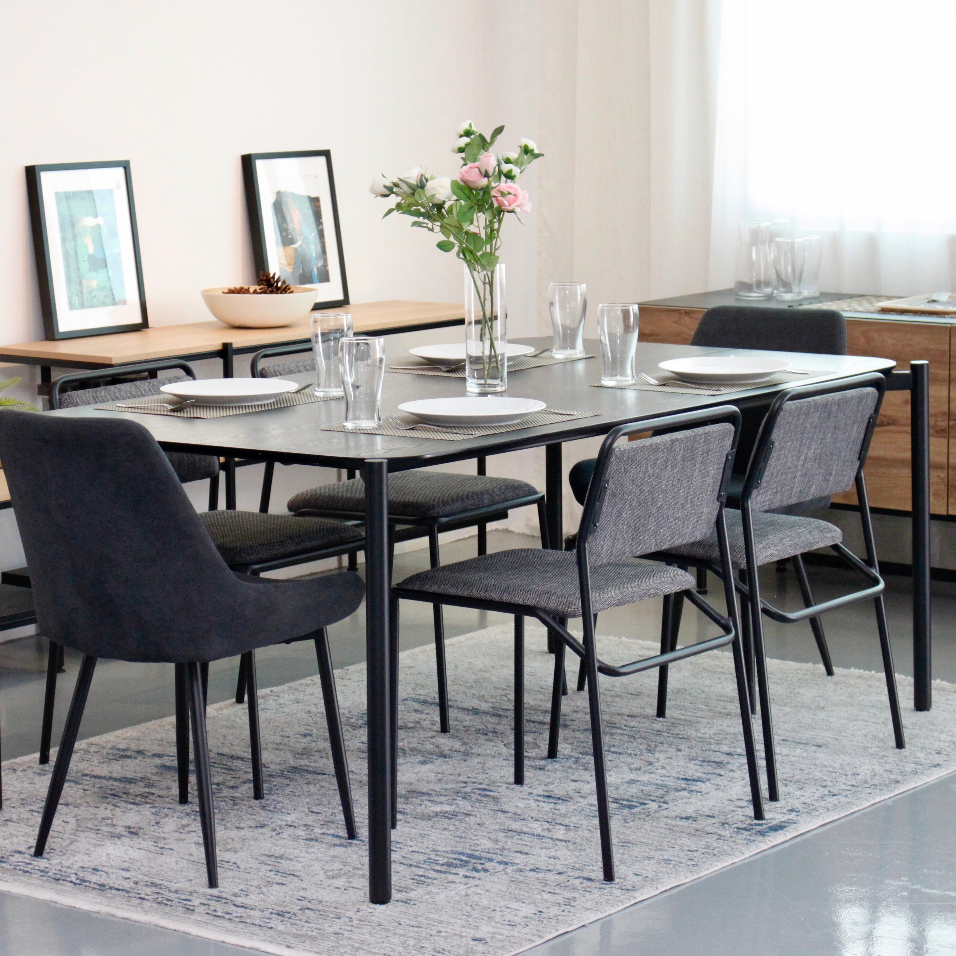 Dining room with a table and chairs in a modern interior setting.