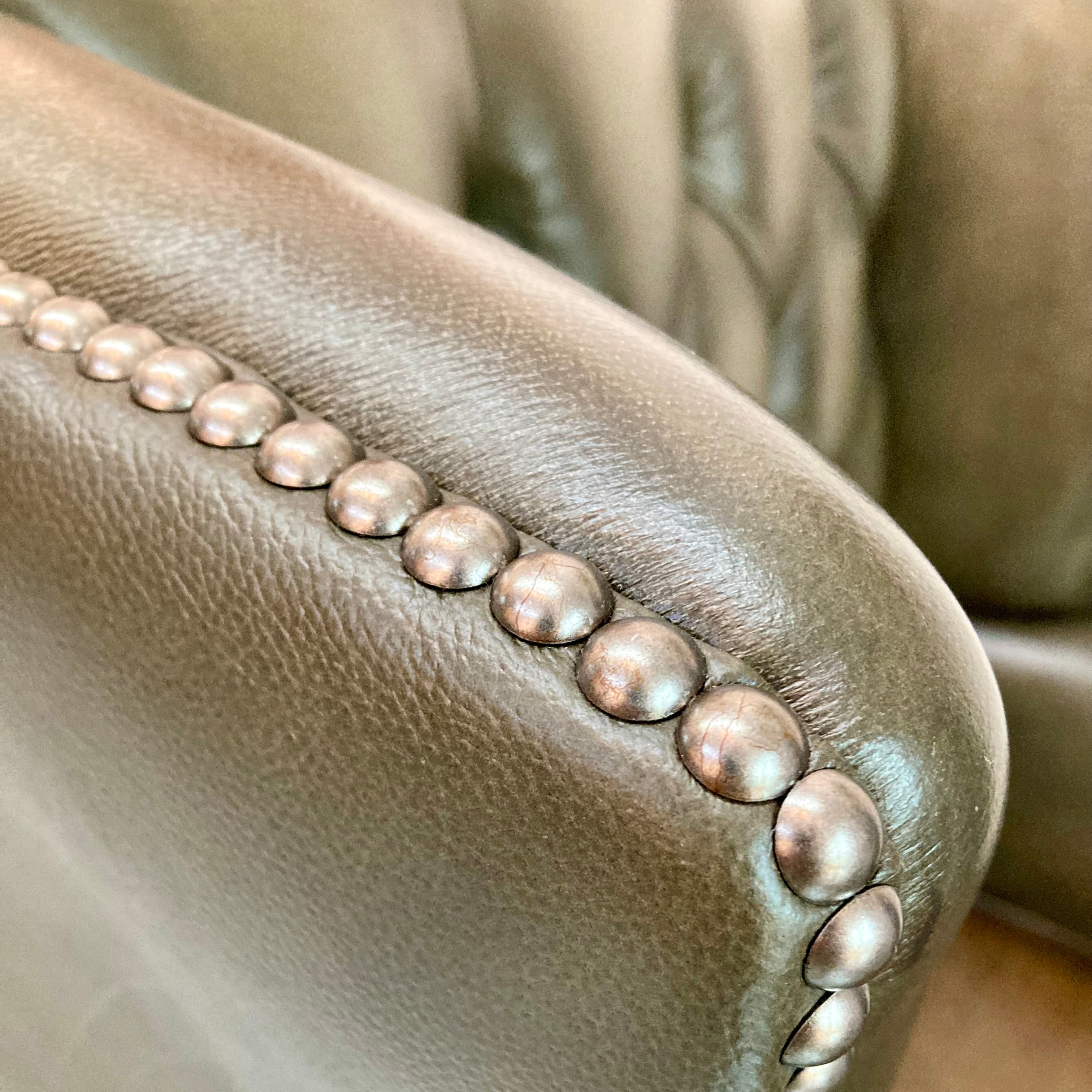 Close-up of a leather chair with pearl-studded detailing