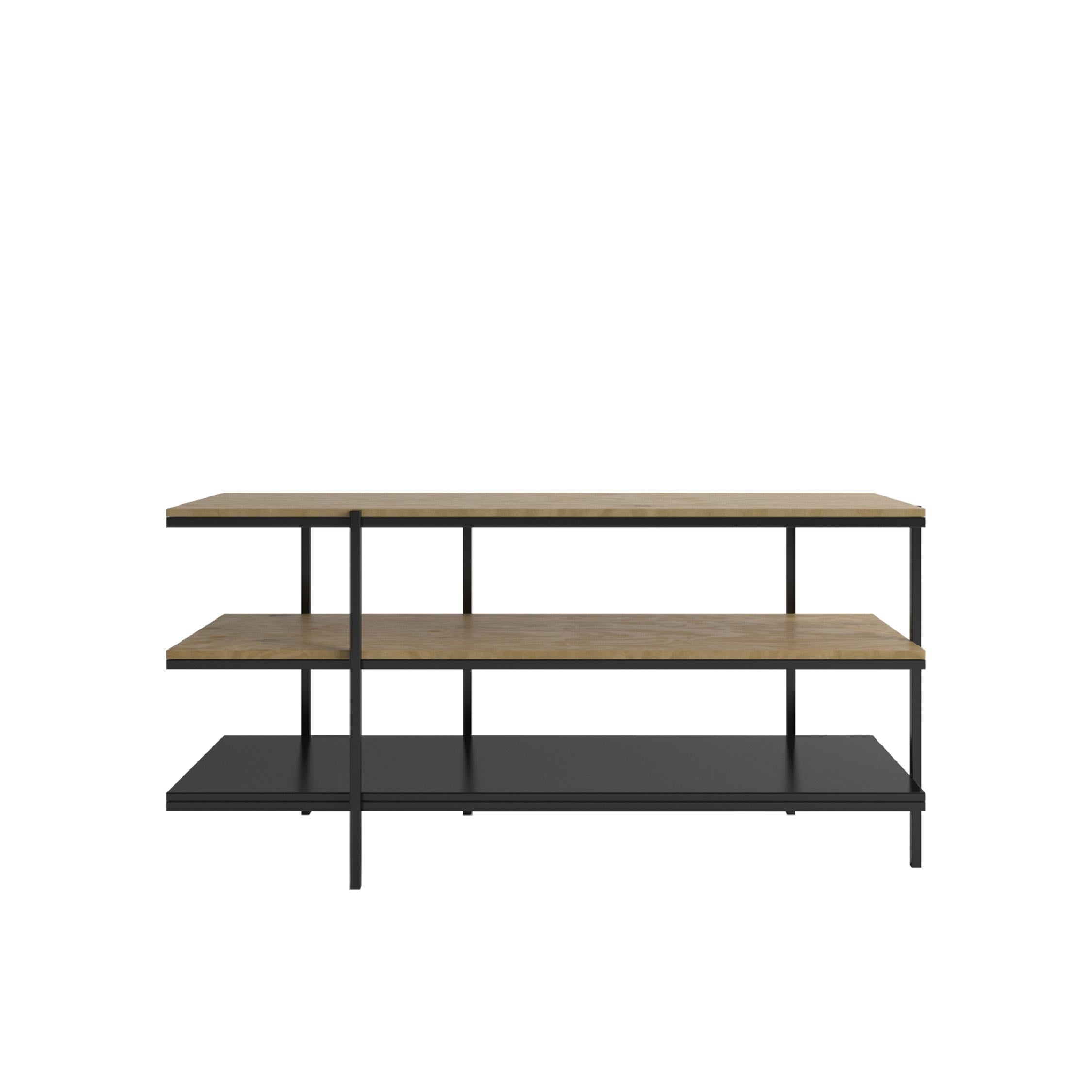 A 3 tier low shelving unit with natural oak upper shelves and black bottom shelf, with a metal frame and legs.